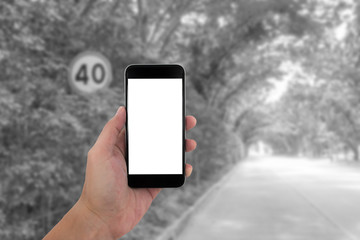 man hand holding the phone and white screen with blur black and