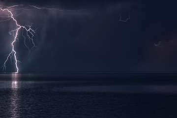 Naklejka na ściany i meble Lightning Storm over big lake Balkhash, Kazakhstan