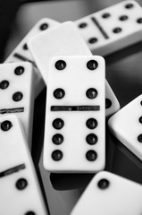 Black and white dominoes on the table