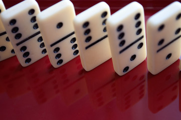 Black and white dominoes on the table