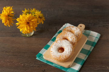 Morning breakfast with powdered sugar donuts