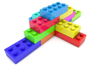 Stacked toy bricks in corner on white