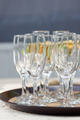 Closeup image of empty stemware standing on a black tray