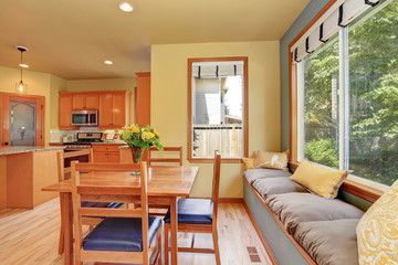 Dining area with wooden table set and cozy sitting place.