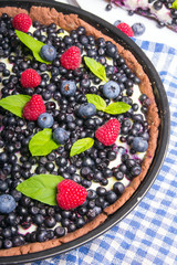 Delicious tart with blueberries and raspberries