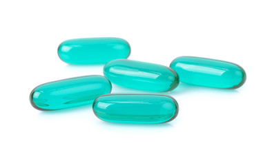 Blue Transparent pills content medicine capsule on white backgro