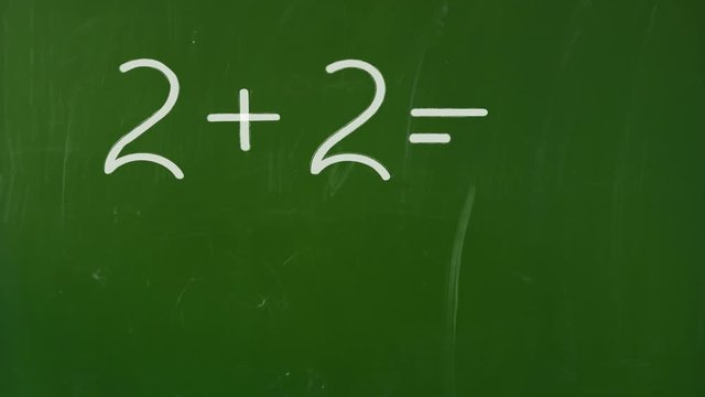 math 2+2= ? appears on green school Board
