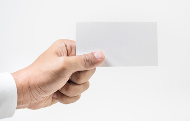 Fototapeta premium Closeup hand wearing white shirt showing blank paper card 
