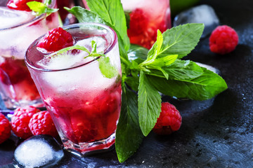 Alcohol mojito cocktail with raspberries, selective focus