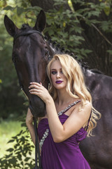 Outdoor portrait of a young girl and horse