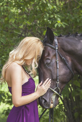 Outdoor portrait of a young girl and horse