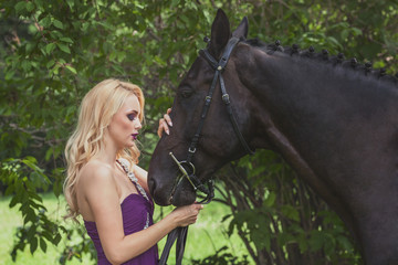 Outdoor portrait of a young girl and horse