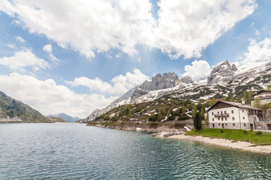 Lake Fedaia and dam at the foot of Marmolada mountain