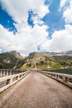 Lake Fedaia and dam at the foot of Marmolada mountain