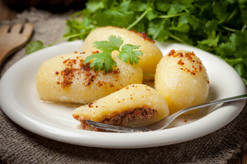 Potato dumplings stuffed with minced meat.