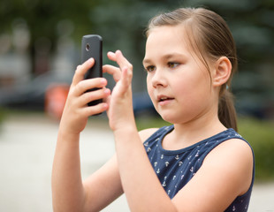 Girl is using smartphone