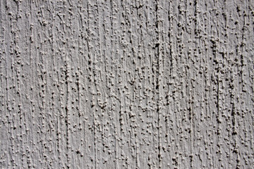 grey wall with decorative plaster as a background