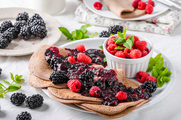 Cocoa pancakes with forest fruit
