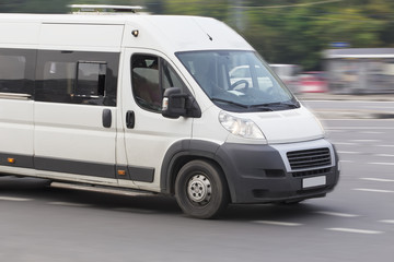 minibus goes on the city street