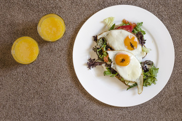 Oatmeal pancakes fresh orange juice coffee and scrambled eggs for breakfast  