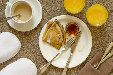 Oatmeal pancakes fresh orange juice coffee and scrambled eggs for breakfast  