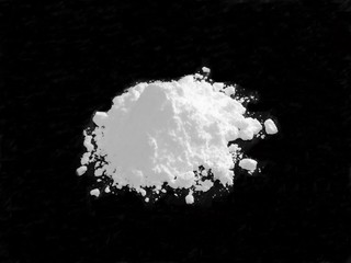 Cocaine drug powder on black background