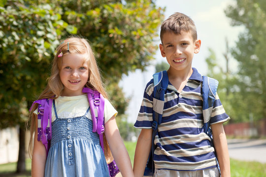 happy brother and sister go to school together,back to school co