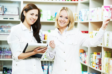 Pharmacy chemist women in drugstore