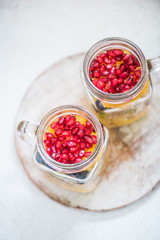 fruit salad topped with pomegranate seeds