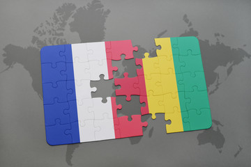 puzzle with the national flag of france and guinea on a world map background.