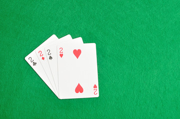 The different suit of the number 2 cards in a deck of cards disp
