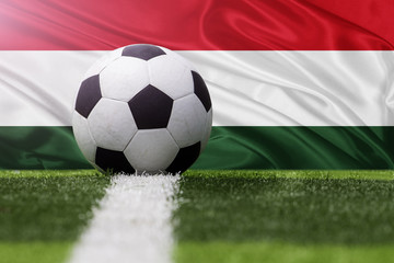 Fototapeta premium Hungary soccer ball against Hungary flag