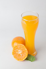 Orange juice and slices of orange isolated on white