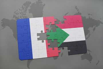 puzzle with the national flag of france and sudan on a world map background.