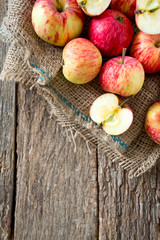 apples on wooden surface