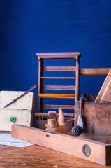 Equipment carpenter on a wooden desk with plans