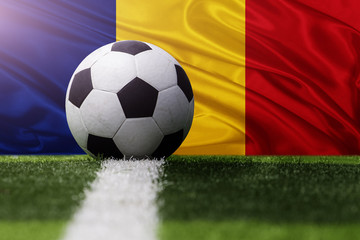 Fototapeta na wymiar soccer ball against Romania flag