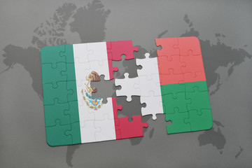 puzzle with the national flag of mexico and madagascar on a world map background.