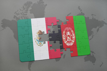 puzzle with the national flag of mexico and afghanistan on a world map background.
