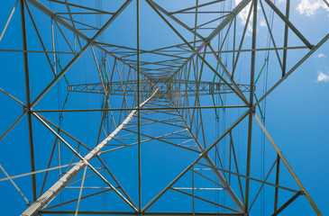 Overhead power line in a blue sky