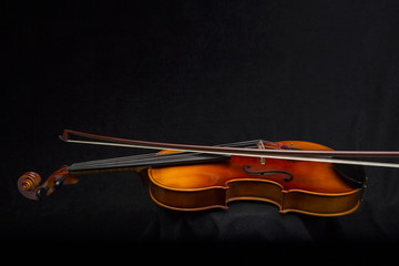 Violin and Bow on black Background with copy area