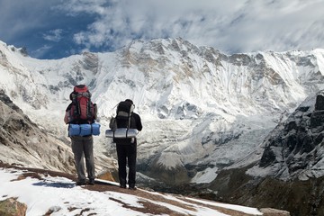 View of Mount Annapurna with two climbers - obrazy, fototapety, plakaty