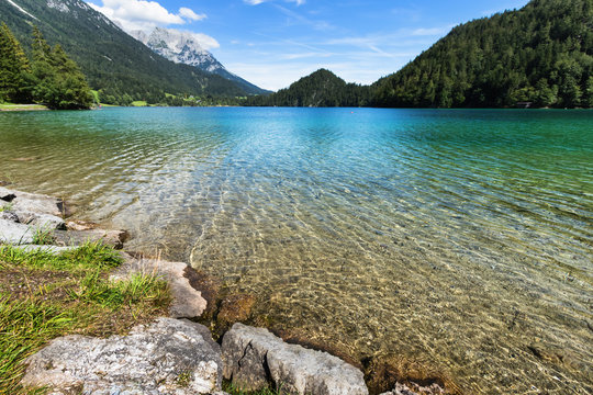 Clear water in a mountain lake. Hintersteiner Lake, Tyrol, Austria.