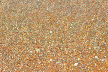 Transparent lagoon water over sand background