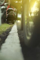 cyclist man legs riding mountain bike ,sun set