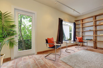 Cozy sitting room with modern chairs in apartment house.