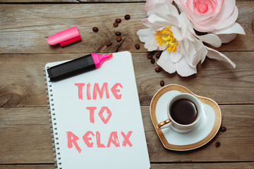 Morning coffee and text in notepad: Time to relax