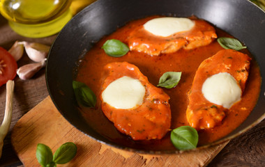 Chciken breast with tomato sauce and melted mozarella cheese