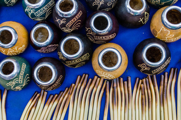 Traditional calabash gourds for drinking Argentina mate tea and bombilla straws at a weekend fair...