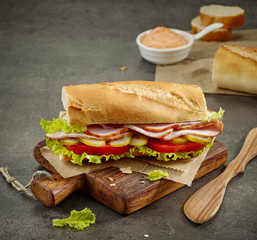 sandwich with smoked meat and vegetables